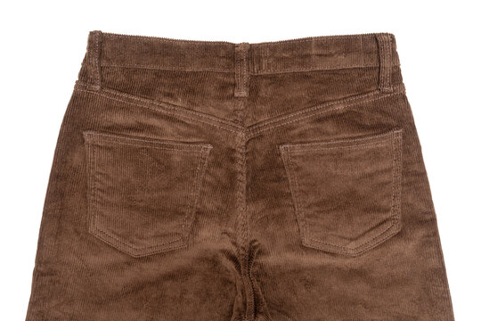 Stylish and comfortable casual corduroy trousers laid out on a flat surface against a white background. Corduroy fabric. Perfect for fashion blogs, textile, apparel, and fashion advertising.