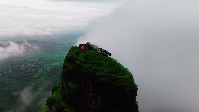 Aerial Orbit Around Misty Hilltop in Lonavala