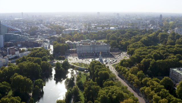 4K aerial drone image of Buckingham Palace, London. Scenic cityscape featuring the royal residence, Victoria Memorial, and St James's Park.