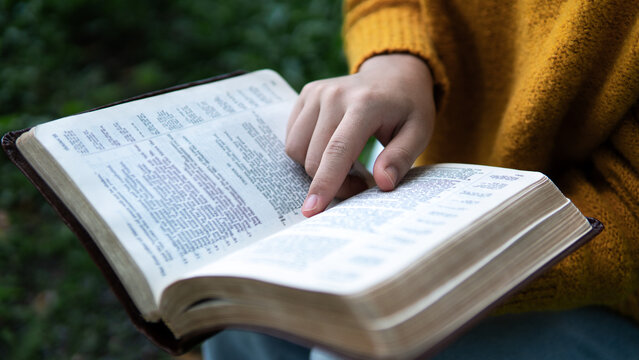 Reading the Bible and asking for blessings from God.