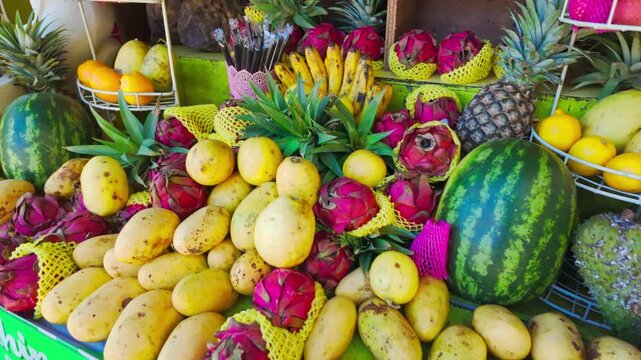 Exotic fruit collection showcased in a busy roadside market scene in Cebu