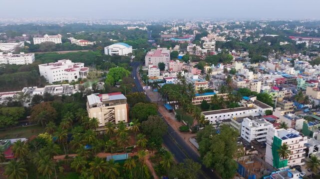 Mysuru city with flying parrots, highway, Karnataka State Open University and Hotel Casa Meridian at mysore, karnataka, india. day time, push in shot, drone shot, 4k.
