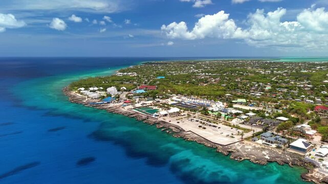North West Point, Cayman Islands: Aerial view of turquoise Caribbean sea, tropical coastline and reef off Grand Cayman - landscape panorama from above
