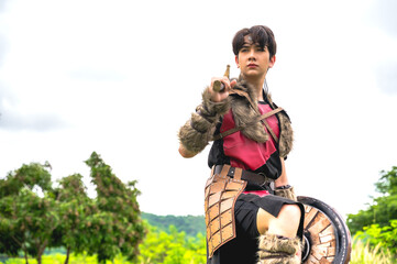 Obraz premium Male ancient warrior in full armor holding shield ready for battle