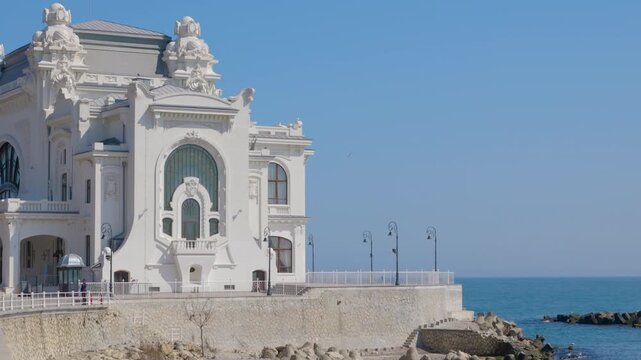 Constanta casino historical landmark standing on the black sea coast. Famous historical art nouveau building of the constanta casino in romania, an abandoned architectural monument