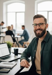 Fototapeta premium Portrait of a Smiling Professional Businessman Working in a Modern Bright Office with Colleagues in the Background