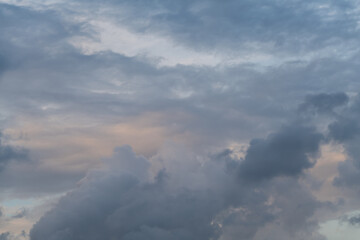 Obraz premium Dark blue and gray clouds at sunset. 