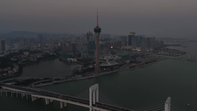 Aerial view of macau tower and sai van bridge at dusk
