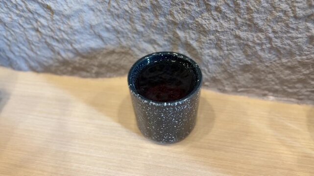 Steaming hot ocha green tea in ceramic cup, traditional Japanese tea experience. BSD, Indonesia - January 5, 2025