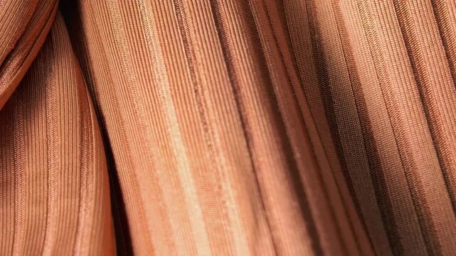 Brown ribbed fabric texture in close up view, textile background, material detail, fashion design concept, abstract surface.