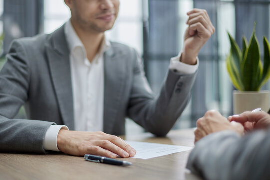 Man gestures confidently during professional meeting