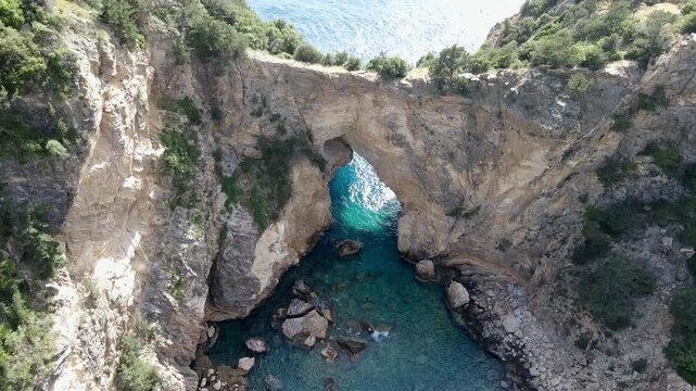 Majestic Natural Rock Arch over Turquoise Sea at Delikdeniz Kral Koyu, Turkey