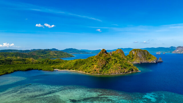 Aerail view of the tropical exotic rain forest island with sea blue ocean  turquoise background in El Nido, Palawan, Philippines.