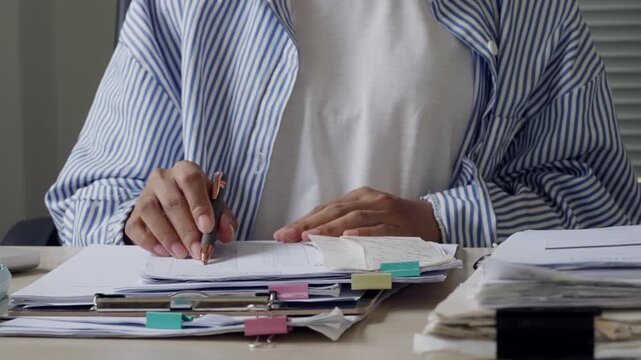 Business assistant signing office documents on clipboard, showing corporate paperwork, file approval, administrative support, record keeping, workflow control, and professional task management.