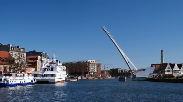 The bascule footbridge to Ołowianka going down. Gdansk, Poland.