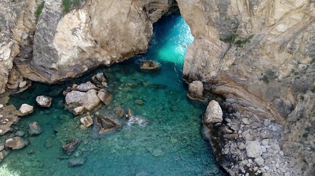 Majestic Natural Rock Arch over Turquoise Sea at Delikdeniz Kral Koyu, Turkey