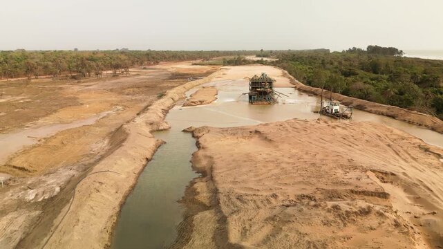 aerial view open pit zircon mine in Abene in Sengal in Africa, exploitation of resources in natural protected area