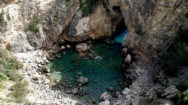 Majestic Natural Rock Arch over Turquoise Sea at Delikdeniz Kral Koyu, Turkey