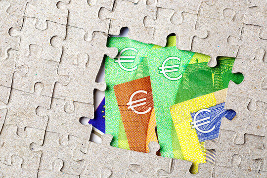 Missing puzzle piece and framed Euro Money Banknotes. Background with copy space for text.Business concept.