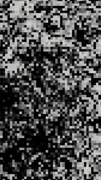 Real photograph of pixel mosaic pattern printed on textured paper surface. Macro close up of physical printed material showing ink pixels and paper grain texture. Photographed from printed source,.