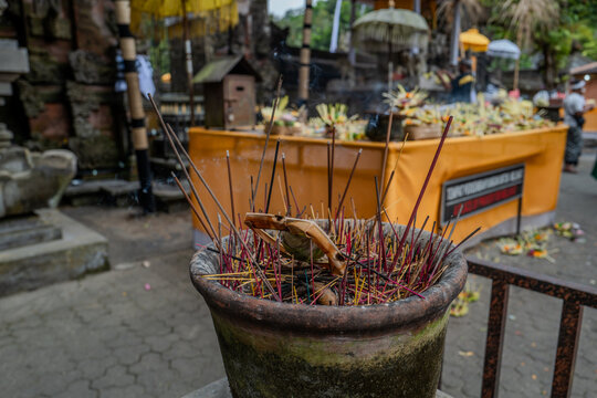 Indonesian statue in a temple with offerings
