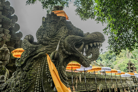 Indonesian statue in a temple with offerings