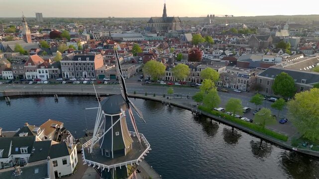 Windmill De Adriaan, since 1779. Old Windmill from the 18th century in Haarlem, Netherlands. Aerial View at Sunset time