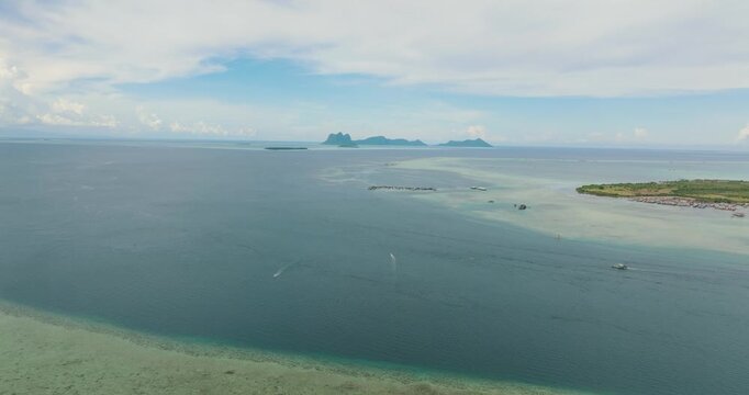 Tropical islands and coral reef in tropic. Tun Sakaran Marine Park. Borneo, Sabah, Malaysia.