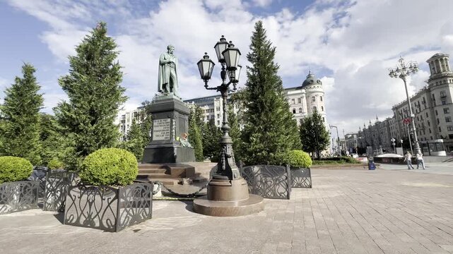 Moscow, Russia, 25 May 2026. Monument to Alexander Pushkin on Pushkin Square surrounded by cypress trees and decorative plants as part of the &ldquo;Summer in Moscow&rdquo; festival. The scene highlights a blend 