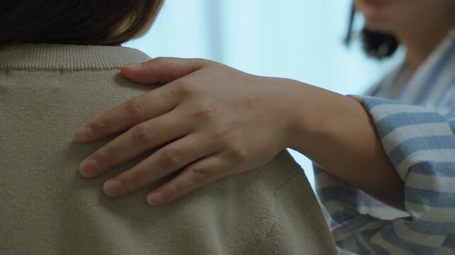 Close Up Hand Gesture Showing Emotional Comfort and Support Between Friends at Home. Friendship support and emotional connection