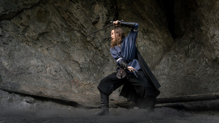 A rugged adventurer stands poised within a cavernous setting, ready to face unseen dangers. © horimono