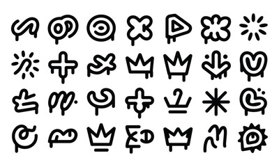 Fototapeta premium Assortment of black and white abstract symbols including crowns, crosses, and sunbursts