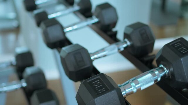 Dumbbell Rack in Gym. Close-Up of Weight Equipment in Modern Fitness Center
