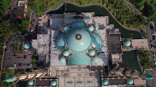 Cinematic overhead aerial shot showcasing the Federal Territory Mosque as the drone pulls back to reveal the mosque layout.
