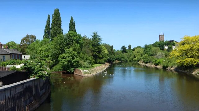 Slow pan of the Devon town of Tiverton overlooking the River Exe