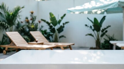 Obraz premium Outdoor Lounge Area with Sunbeds and Plants for Relaxation Concept
