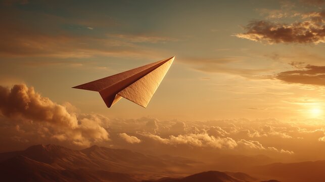 Paper airplane soaring through golden sunset sky with dramatic lighting, freedom concept and cinematic aerial perspective