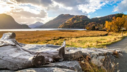 Fototapeta premium Autumnal Landscape with Mountains and Lake at Sunset.