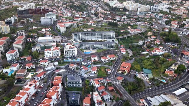 Aerial view of Funchal cityscape, flying over the Barreiros - Virtudes neighborhood in Madeira Island, Portugal.	