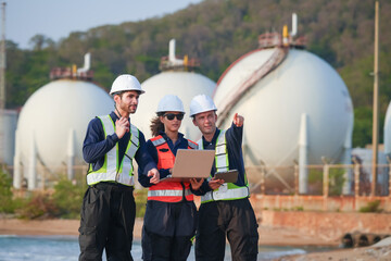 Fototapeta premium Safety meeting among engineers at industrial facility team collaboration outdoor environment professional viewpoint