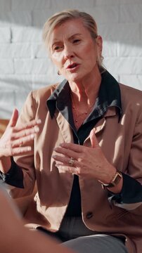 Counselor, talk and woman with group therapy in office for stress management, guidance or solution. Mental health, EAP and mature therapist at work counseling for burnout, peer support and assistance