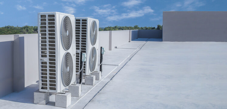 air conditioning and ventilation systems are installed on the roof of an industrial building.
