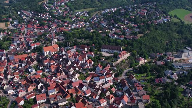 Aerial view above the old town of the city Gr&uuml;nsfeld in Germany on a sunny summer noon
