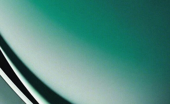 Close-up of curved metallic car fender in light