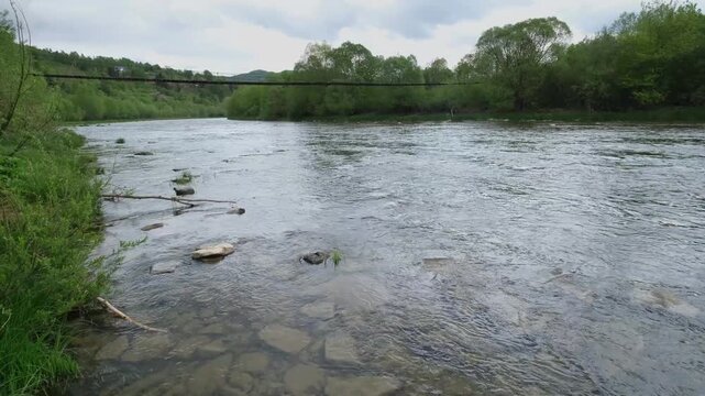 Spring picturesque mountain river band view. (Stryi river near Skhidnytsya village, Carpathians, Ukraine.)
