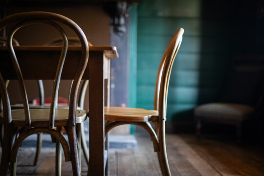 Rustic Wooden Chairs Around Vintage Dining Table