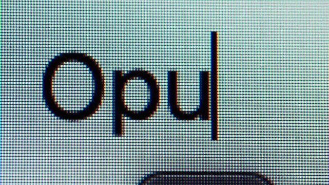 Qingdao,China-Jun.1.2026:A macro shot of a computer screen displaying the lowercase text "Opus"