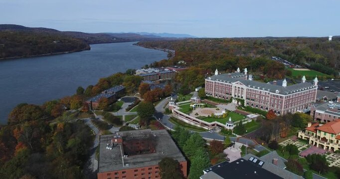 Aerial view of The Culinary Institute of America campus overlooking the Hudson River surrounded by autumn foliage in Hyde Park, New York, United States.