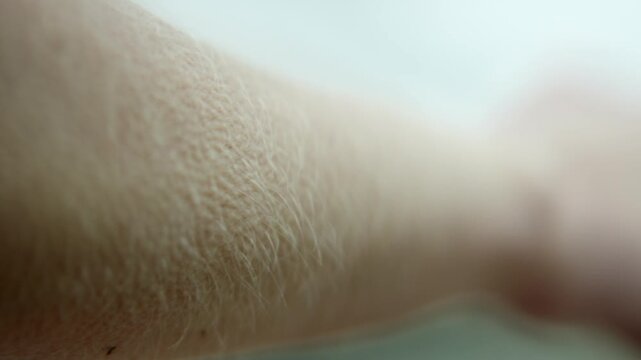 Feeling goosebumps on skin during a moment of surprise in a warm setting