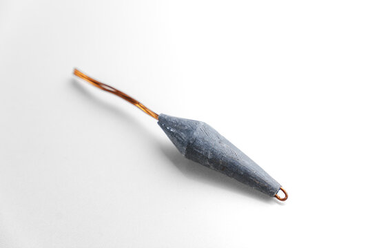 Old lead fishing sinkers on a white background. fishing tools.